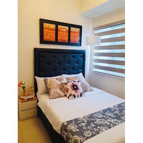 1 Br CONDO Vine Residences Quezon City with POOL NETFLIX WIFI VIDEOKE BOARD GAMES