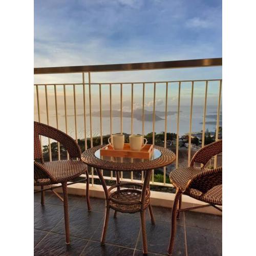 1 BR Cozy Farmhouse-Style Condo with Balcony & Taal View at Wind Residences