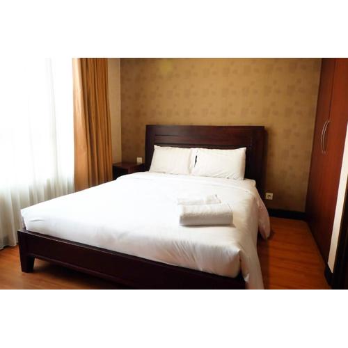 2BR Prestige Essence Dharmawangsa Apartment By Travelio