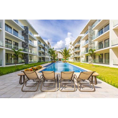 2BR Tropical Escape - Private Terrace, BBQ, Pool, Walk to Beach