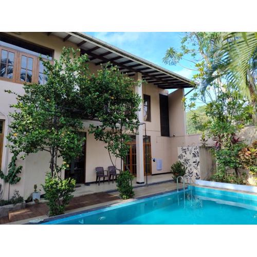 A tropical paradise; stunning house, pool, garden