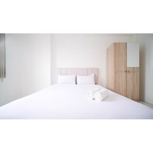 Best Choice 2BR at Puncak Dharmahusada Apartment Surabaya By Travelio