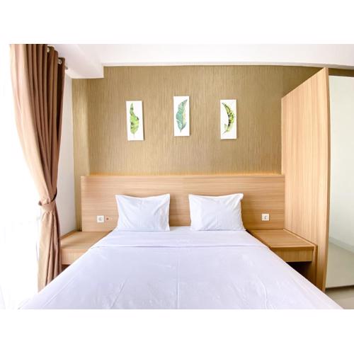 Best Homey 1BR at 25th Floor Vasanta Innopark Apartment By Travelio