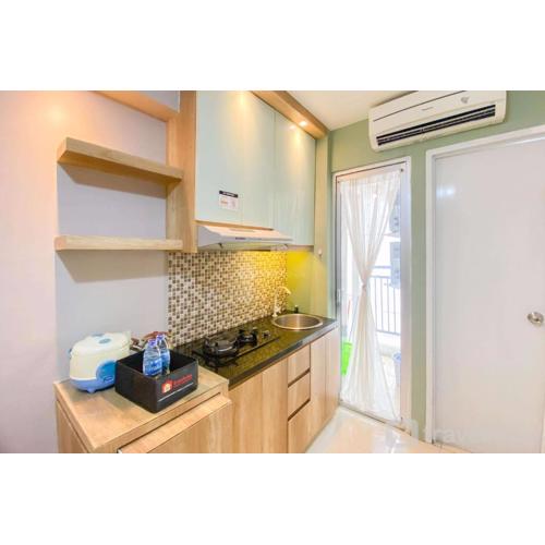 Best Strategic 2BR Apartment at Bassura City By Travelio