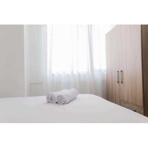 Brand New and Homey 2BR Meikarta Apartment By Travelio