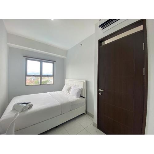 Bright and Relaxing 2BR Apartment at Mekarwangi Square Cibaduyut By Travelio