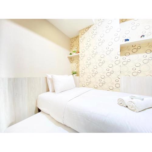 Chic and Cozy 2BR at Mekarwangi Square Cibaduyut Apartment By Travelio