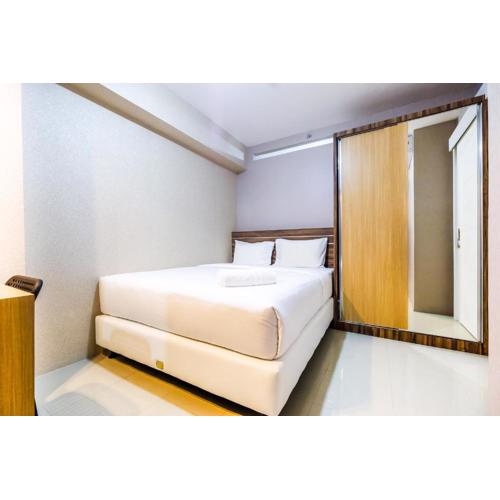 Classic 2BR Bassura City Apartment By Travelio