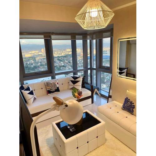 Classy 2BR Suite at Eastwood City with Pool and City Skyline View