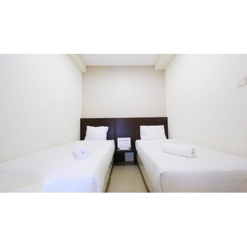 Clean and Cozy 2BR Apartment Parahyangan Residence By Travelio