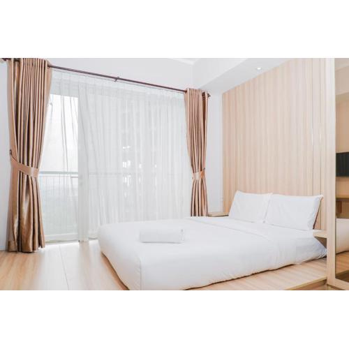 Clean and Elegant 1BR at The Oasis Apartment By Travelio