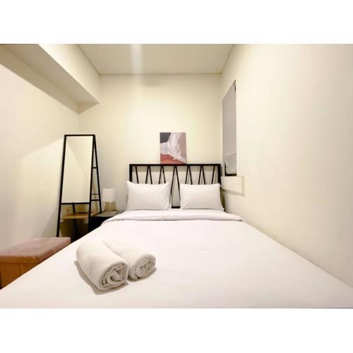 Clean and Homey 2BR at Meikarta Apartment By Travelio