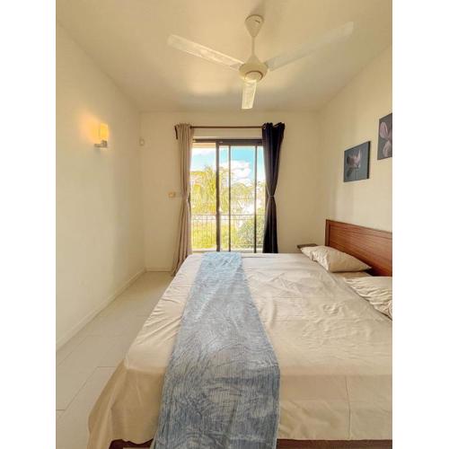 Coastal Charm Apartment l 2 Bedrooms situated on second floor l Mont Choisy l Shared Pool l Fully Equipped Kitchen l Parking Space l Close to all amenities