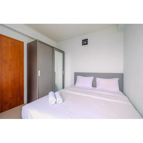 Combined 2BR with Study Room Titanium Square Apartment By Travelio