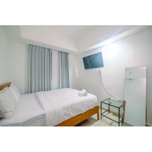 Comfort 1BR Apartment at Evenciio Margonda By Travelio