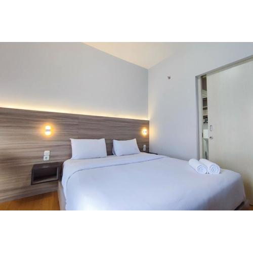 Comfort 1BR at Amartha View Apartment By Travelio
