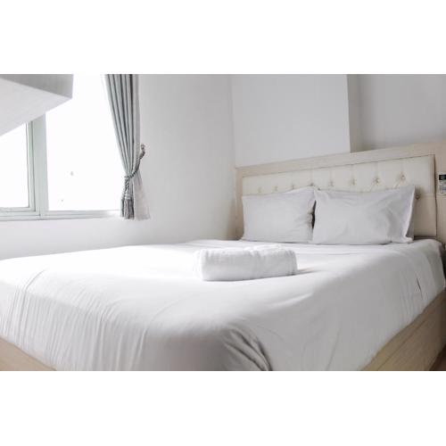 Comfort 2BR Bassura City Apartment near Shopping Center By Travelio