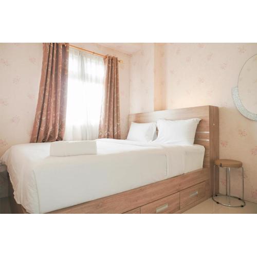 Comfort 2BR Green Pramuka City Apartment near Shopping Center By Travelio