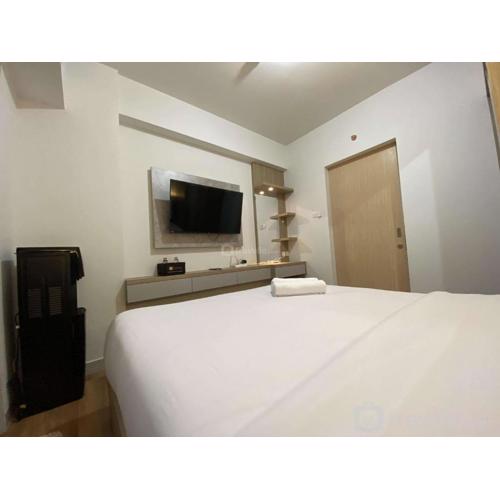 Comfort and Cozy Stay 1BR at The Alton Apartment By Travelio