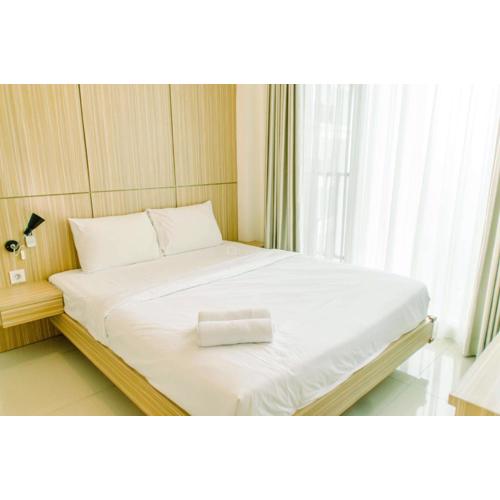 Comfort and Minimalist 1BR at Tree Park City BSD Apartment By Travelio