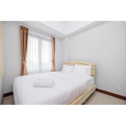 Comfort and Modern 2BR at Royal Heights Apartment By Travelio