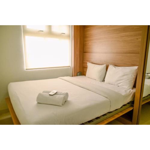 Comfort and Simple 2BR at Green Pramuka City Apartment By Travelio