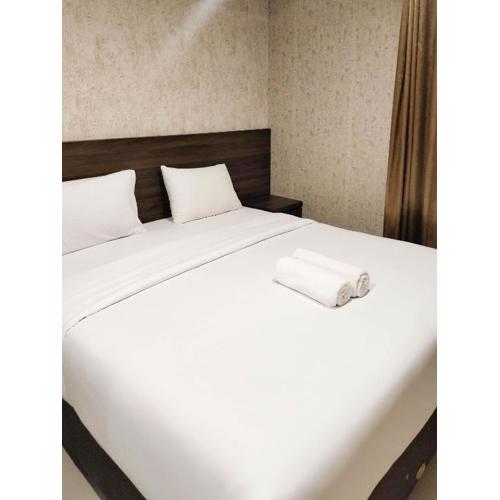 Comfort and Simply 1BR at Patraland Amarta Apartment By Travelio