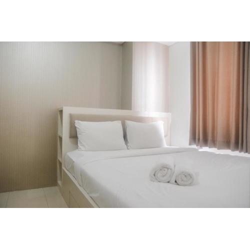 Comfort Living 2BR Room at Bassura City Apartment By Travelio