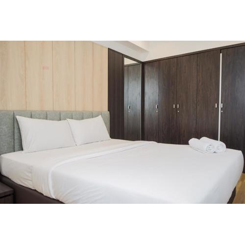 Comfy 1BR Apartment with Motorized Standing Desk at Branz BSD City By Travelio