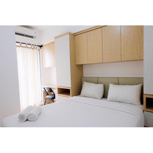 Comfy 2BR Apartment at M-Town Residence By Travelio