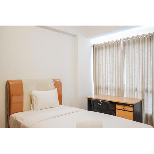 Comfy and Minimalist Studio Apartment Scientia Residence Tower B By Travelio