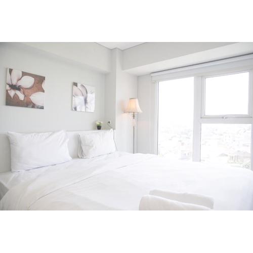 Comfy and Spacious 2BR Loft Apartment Maqna Residence By Travelio