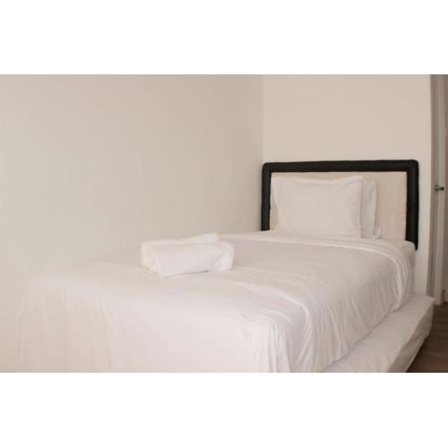 Comfy and Tidy Studio at Riverview Jababeka Apartment By Travelio