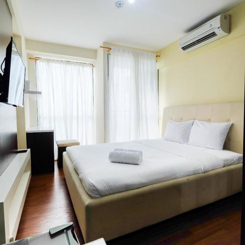 Comfy Studio Tifolia Apartment By Travelio