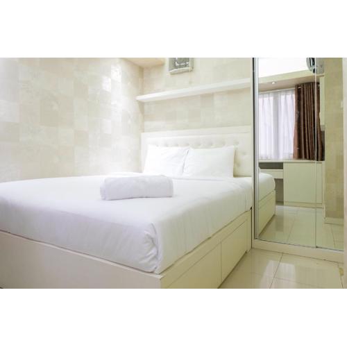 Compact 2BR Bassura City Apartment By Travelio