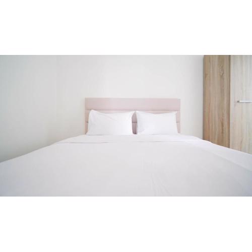 Compact and Tidy Studio at Puncak Dharmahusada Apartment By Travelio