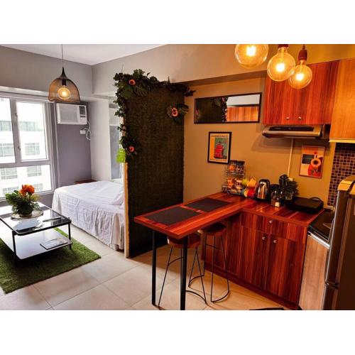 Condo at Avida Towers Riala T2 Bright, Cozy Studio with a Touch of Nature