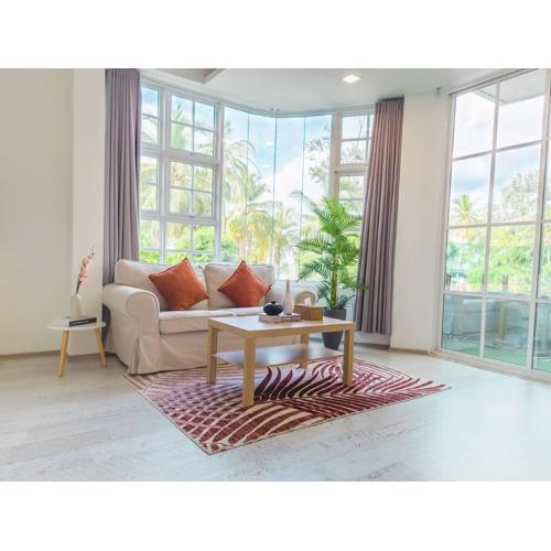 Cozy 1BR apartment by beach - partial ocean view