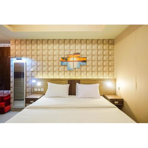 Cozy 1BR Apartment with Workspace at Mustika Golf Residence By Travelio