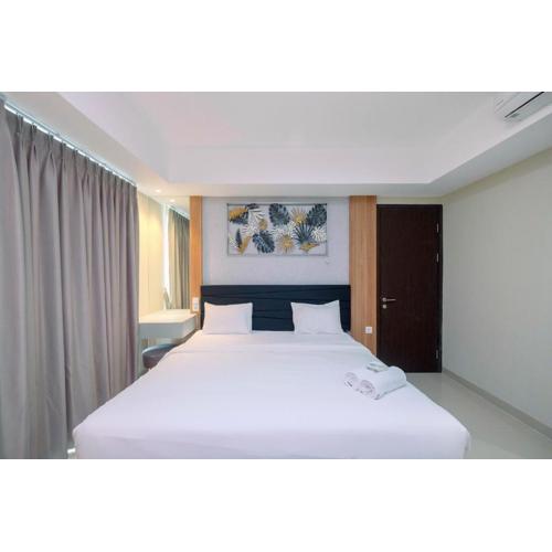 Cozy 2BR Apartment Nine Residence with City View By Travelio