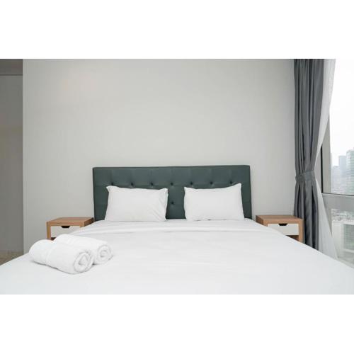 Cozy 2BR at Empyreal Epicentrum Apartment By Travelio