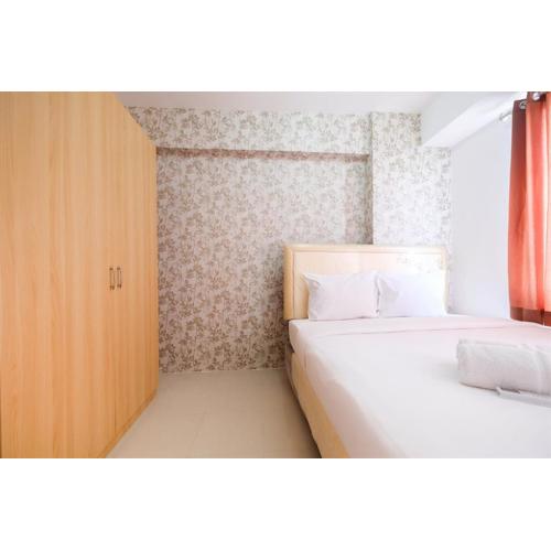 Cozy 2BR Bassura City Apartment with City View By Travelio