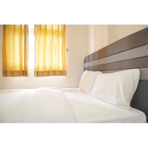 Cozy 2BR Green Pramuka City Apartment near Shopping Mall By Travelio