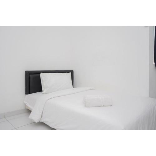 Cozy and Calm Studio No Kitchen Apartment at Aeropolis Residence By Travelio