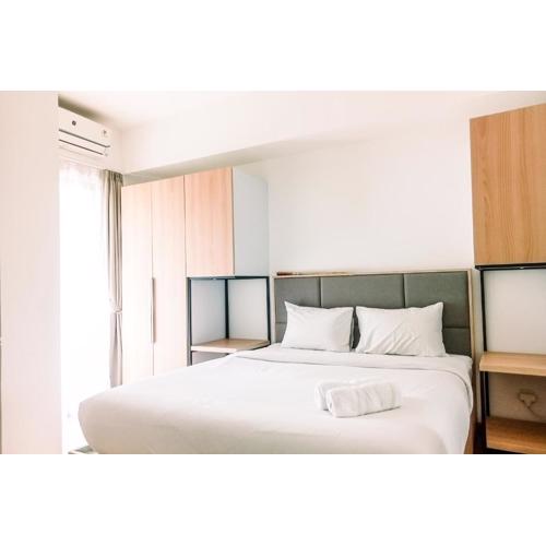 Cozy and Elegant with Pool View 2BR Apartment at M-Town Residence By Travelio