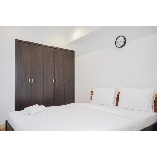 Cozy and Spacious 1BR Apartment at Branz BSD City By Travelio
