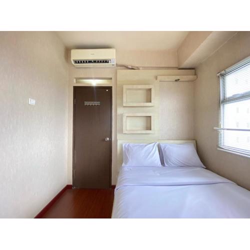 Cozy and Spacious 2BR at Suites @Metro Apartment By Travelio