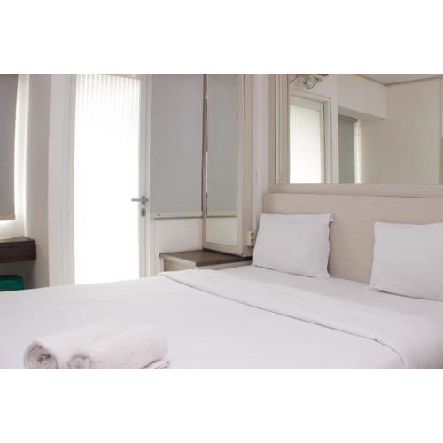 Cozy and Warm Studio at Grand Sentraland Karawang Apartment By Travelio