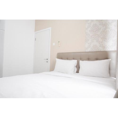 Cozy and Well Designed 2BR at Green Pramuka City Apartment By Travelio