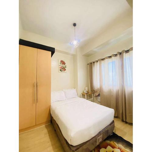 Cozy Iloilo City Condo Room with Shared Pool